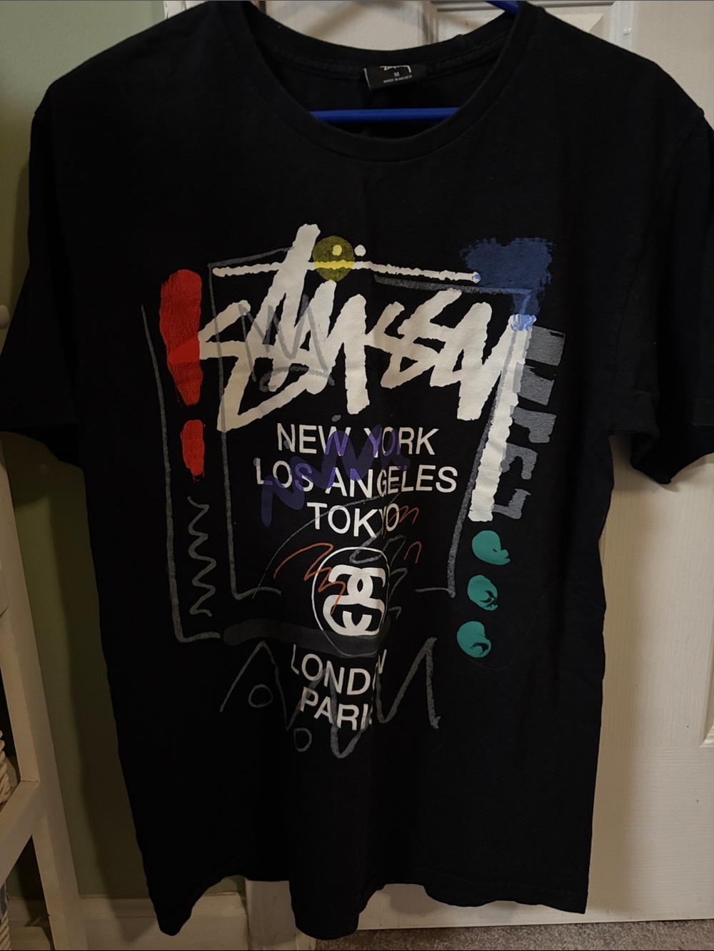 Stussy Black Tee with Multicolor Graphic Accents